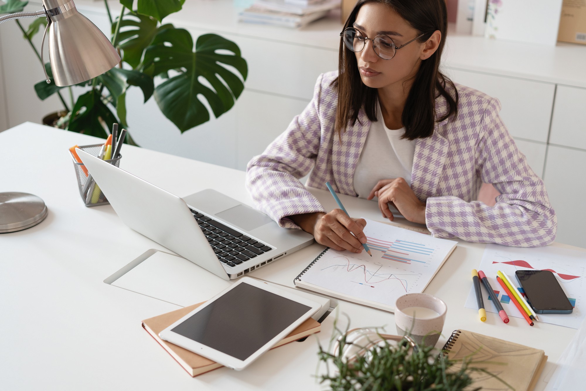 Person reviewing finances at a tidy desk